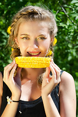 Image showing woman eating corn-cob