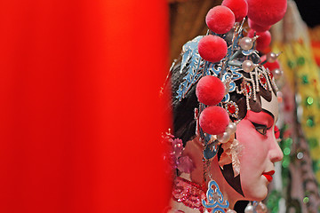 Image showing chinese opera dummy and red cloth as text space ,it is a toy,not