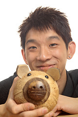 Image showing asia man with piggy bank 