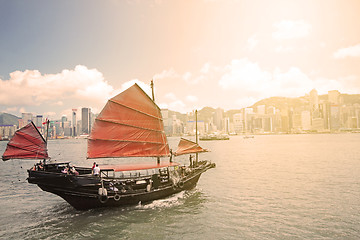 Image showing Junk boat with tourists in Hong Kong Victoria Harbour