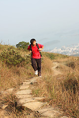 Image showing Sport hiking in mountains, walking and backpacking 