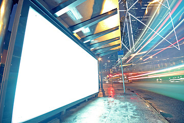 Image showing white display advertising with traffic at night 