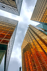 Image showing Skyscrapers with clouds reflection 