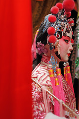 Image showing chinese opera dummy and red cloth as text space ,it is a toy,not