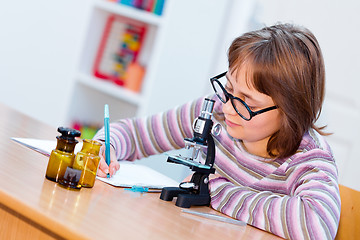 Image showing Teen science girl with microscope