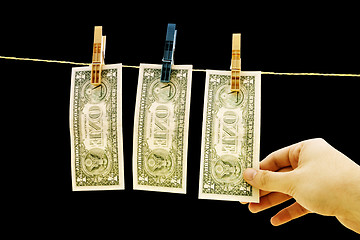 Image showing Dollars on the wire