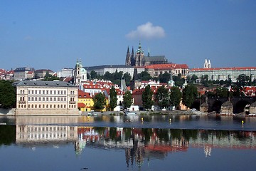 Image showing Prague castle with the Carls Bridge reflected in river