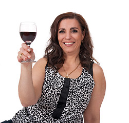 Image showing Smiling mature woman with a glass of wine