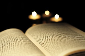 Image showing book and candle