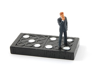 Image showing business man on domino isolated