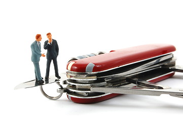 Image showing business people on penknife