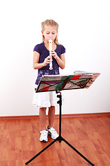 Image showing Girl playing flute