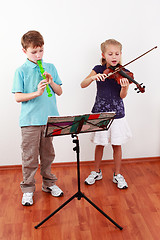 Image showing Kids playing flute and violin