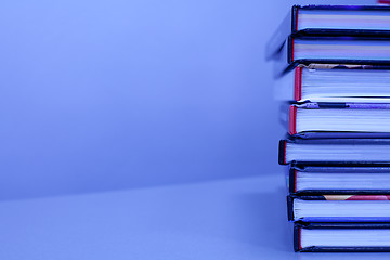 Image showing stack of books on the table