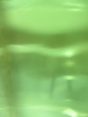 Image showing Light through a green bottle