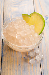 Image showing tapioca pearls with lime. white bubble tea ingredients