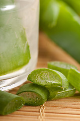 Image showing aloe vera juice with fresh leaves