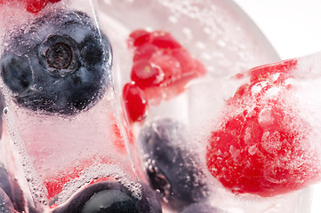 Image showing Raspberry and blackberry frozen in ice sticks