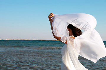 Image showing Woman in white at seaside