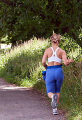 Image showing fat woman running around in the park
