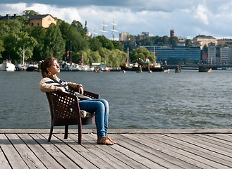 Image showing girl sitting in the pier