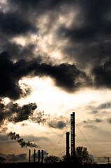 Image showing Silhouette of a power plant against evening sky