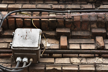 Image showing old brick wall with electrical boxes