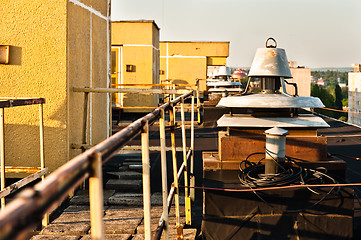 Image showing Roof of an abandoned building, with ventillation vents and pathw