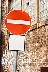 Image showing Prohobition traffic sign against abandoned industrial background