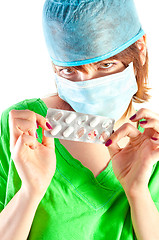 Image showing Beutiful doctor showing the pills you should take