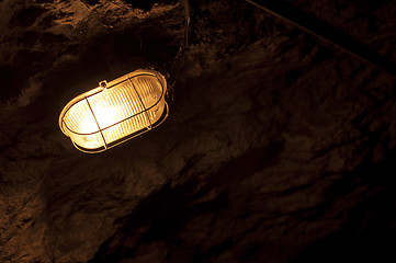 Image showing Old electric light in cavern