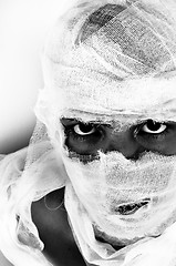 Image showing Scary portrait of a girl wrapped in bandage