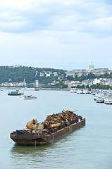 Image showing Boat with metal junk floating on water