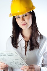 Image showing Beautiful business woman with construction plans