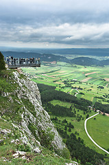 Image showing Lookout point with green fields and mountains