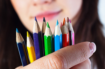 Image showing Student girl with colored pencils