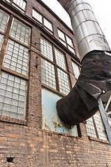 Image showing Fragment of old industrial building with heat pipe