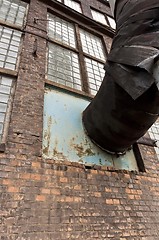 Image showing Fragment of old industrial building with heat pipe