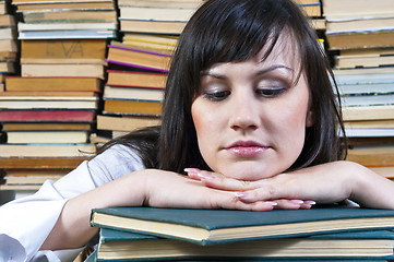 Image showing A beautiful young student girl with her books