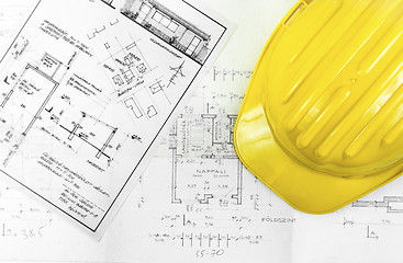 Image showing Construction plans with tools of a worker