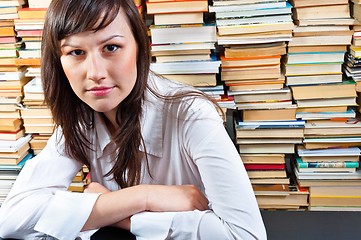 Image showing Beautiful young student girl in library