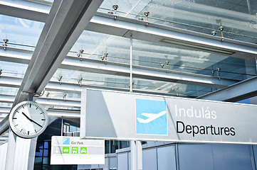 Image showing Departure sign at airport with airplane