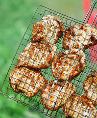 Image showing Steaks in Barbecue grill