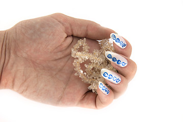 Image showing A woman hand with a citrine beads