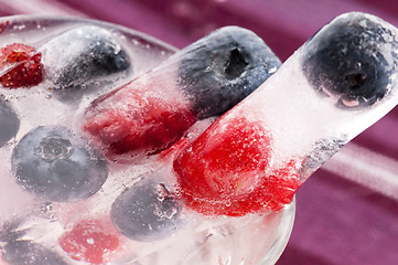 Image showing Raspberry and blackberry frozen in ice sticks