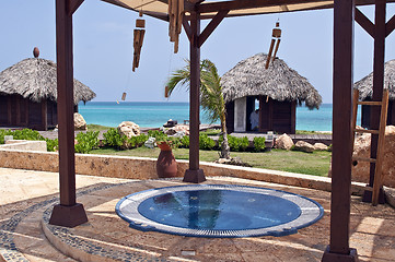 Image showing Jacuzzi and massage huts in the Caribbean.