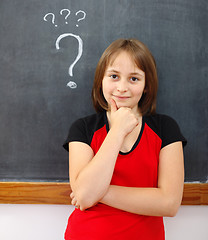 Image showing Young elementary school girl thinking