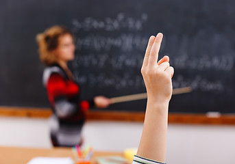 Image showing Raised arm in math class