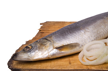 Image showing Herring with onion rings on old wooden board