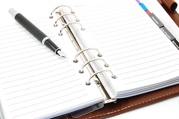 Image showing business organizer and pen